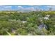 Beautiful aerial view showcasing a neighborhood with mature trees and nearby buildings along the water at 2512 W Jetton Ave, Tampa, FL 33629