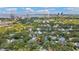 Wide aerial shot of a residential neighborhood with tall buildings along the coast in the background at 2512 W Jetton Ave, Tampa, FL 33629