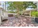 Spacious backyard with covered patio, hot tub, lounge chairs, and mature trees at 2512 W Jetton Ave, Tampa, FL 33629