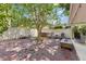Private backyard with lush landscaping, hot tub, and outdoor lounge seating at 2512 W Jetton Ave, Tampa, FL 33629