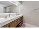 Sleek bathroom features a double vanity with modern faucets, and under cabinet storage at 2512 W Jetton Ave, Tampa, FL 33629