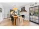 Inviting dining room features a large table, fireplace, and access to the outdoor patio at 2512 W Jetton Ave, Tampa, FL 33629