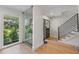 A contemporary entryway showcases a glass-enclosed shower and open access to the upper level at 2512 W Jetton Ave, Tampa, FL 33629