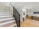 Staircase leads to light-filled living area with open floor plan and stylish decor at 2512 W Jetton Ave, Tampa, FL 33629