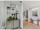 A modern entryway features a wine rack, staircase, and stylish decor, offering an inviting first impression at 2512 W Jetton Ave, Tampa, FL 33629