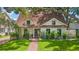 Charming one-story home with a brick walkway and lush landscaping, enhancing its curb appeal at 2512 W Jetton Ave, Tampa, FL 33629