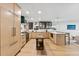 Bright, expansive kitchen features custom cabinetry, stainless steel appliances, and ample counter space at 2512 W Jetton Ave, Tampa, FL 33629