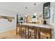 Modern kitchen features light wood cabinets, white countertops, and a breakfast bar with seating at 2512 W Jetton Ave, Tampa, FL 33629