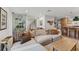 Spacious living area features a neutral color scheme, wood floors, and easy kitchen access at 2512 W Jetton Ave, Tampa, FL 33629