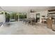 Covered patio offers an outdoor dining area and comfortable lounge space at 2512 W Jetton Ave, Tampa, FL 33629
