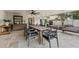 Spacious covered patio with outdoor dining, lounge area, and backyard views at 2512 W Jetton Ave, Tampa, FL 33629