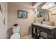 Charming powder room featuring patterned tile floors and elegant fixtures at 2512 W Jetton Ave, Tampa, FL 33629