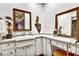 Bathroom featuring dual vanity sinks and decorative mermaid statue for a unique, personalized touch at 269 Los Prados Dr # 1011, Safety Harbor, FL 34695