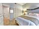 Cozy bedroom with tiled floor, ample closet space and natural light, creating a warm and inviting atmosphere at 269 Los Prados Dr # 1011, Safety Harbor, FL 34695