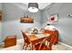 Dining area featuring wooden furniture, a decorative ship model, and neutral wall color at 269 Los Prados Dr # 1011, Safety Harbor, FL 34695