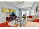 Bright living room featuring modern decor, a large TV, and comfortable seating for relaxation at 269 Los Prados Dr # 1011, Safety Harbor, FL 34695