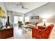 Inviting living room featuring a comfortable sofa, a glass coffee table, and natural lighting at 269 Los Prados Dr # 1011, Safety Harbor, FL 34695