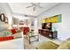 Spacious living room with a dining area, a modern sofa, and a stylish glass coffee table at 269 Los Prados Dr # 1011, Safety Harbor, FL 34695