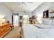 Spacious bedroom with neutral tones, access to bathroom and closet, and carpeted floor for comfort and style at 269 Los Prados Dr # 1011, Safety Harbor, FL 34695