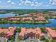 Community aerial view of waterfront residences, marina, and serene surroundings at 2733 Via Cipriani # 830B, Clearwater, FL 33764