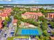 Community aerial view showcasing the tennis court and surrounding residences at 2733 Via Cipriani # 830B, Clearwater, FL 33764