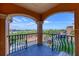 Private balcony with decorative railings offering a scenic view of the community at 2733 Via Cipriani # 830B, Clearwater, FL 33764