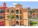 Close-up exterior shot of condo featuring private balconies and classic Mediterranean architecture at 2733 Via Cipriani # 830B, Clearwater, FL 33764