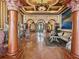 Grand foyer with marble floors, decorative columns, and ornate details at 2733 Via Cipriani # 830B, Clearwater, FL 33764