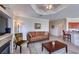 Inviting living area featuring a fireplace, comfortable seating, and easy access to the kitchen at 2733 Via Cipriani # 830B, Clearwater, FL 33764