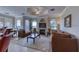 Spacious living room showcasing a fireplace, plush seating, and seamless flow to dining area at 2733 Via Cipriani # 830B, Clearwater, FL 33764