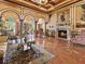 Elegant living room featuring a fireplace, marble floors, and luxury furnishings at 2733 Via Cipriani # 830B, Clearwater, FL 33764