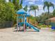 A colorful playground with slides, climbing structures, and soft ground cover for safe and fun activities at 2733 Via Cipriani # 830B, Clearwater, FL 33764