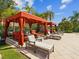 Relaxing poolside cabanas with comfortable seating, offering shade and privacy at 2733 Via Cipriani # 830B, Clearwater, FL 33764