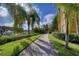 Landscaped walkway between buildings, offering a scenic waterfront view and lush greenery at 2733 Via Cipriani # 830B, Clearwater, FL 33764