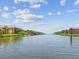 Beautiful waterfront view between buildings, showcasing the serene community at 2733 Via Cipriani # 830B, Clearwater, FL 33764
