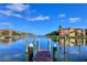Scenic waterfront view featuring calm blue waters and luxury condo buildings, great for boating at 2733 Via Cipriani # 830B, Clearwater, FL 33764