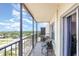 Private balcony with chairs offers panoramic community views under a sunny sky at 2901 26Th W St # 815, Bradenton, FL 34205