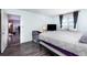 Cozy bedroom featuring laminate wood floors, a large window, and a comfortable bed at 2901 26Th W St # 815, Bradenton, FL 34205