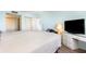 Bright bedroom with natural light, wood-look floors, large bed, modern light, and ample closet space at 2901 26Th W St # 815, Bradenton, FL 34205