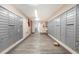 A bright mailroom features rows of mailboxes on both sides of the room with gray wood-like flooring at 2901 26Th W St # 815, Bradenton, FL 34205