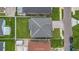A bird's-eye view of a pristine roof and well-maintained yard, highlighting meticulous property upkeep and attention to detail at 3013 W Crest Ave, Tampa, FL 33614