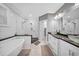 The bathroom features a soaking tub, a walk-in shower, and dual glass vessel sinks at 3013 W Crest Ave, Tampa, FL 33614