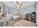 Bright bedroom with soft natural light, neutral paint, hardwood floor, and plenty of space to relax at 3013 W Crest Ave, Tampa, FL 33614