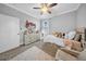Bright bedroom featuring neutral decor, ceiling fan, and plenty of natural light, perfect for a retreat at 3013 W Crest Ave, Tampa, FL 33614