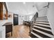 Inviting dining area near the home's entry features a staircase and seamless transition to other living spaces at 3013 W Crest Ave, Tampa, FL 33614