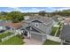 Eye-catching home featuring a well-maintained yard, gray exterior, and inviting front porch seating at 3013 W Crest Ave, Tampa, FL 33614