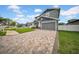 Attractive two-story house with a lovely brick driveway and neatly trimmed landscaping, creating a welcoming exterior at 3013 W Crest Ave, Tampa, FL 33614