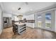 Bright, modern kitchen with stainless steel appliances, an island with seating, and access to the backyard at 3013 W Crest Ave, Tampa, FL 33614