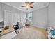 Functional office space with neutral tones, featuring a desk and ample natural light, ideal for productivity at 3013 W Crest Ave, Tampa, FL 33614