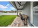 Back patio with brick pavers, ceiling fan, and grill. A great place for outdoor entertaining at 3013 W Crest Ave, Tampa, FL 33614